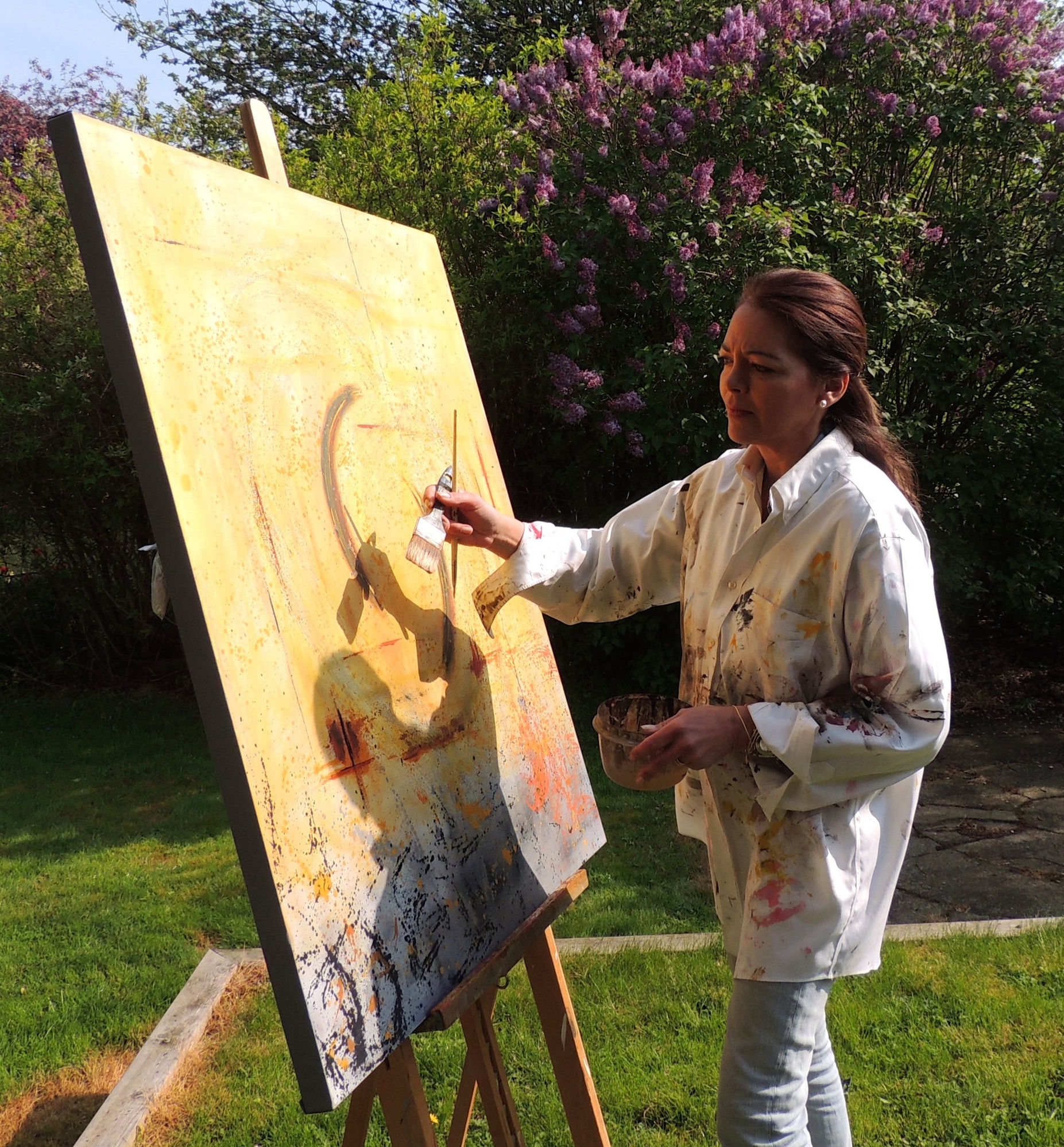 Carla Figallo painting in her studio
